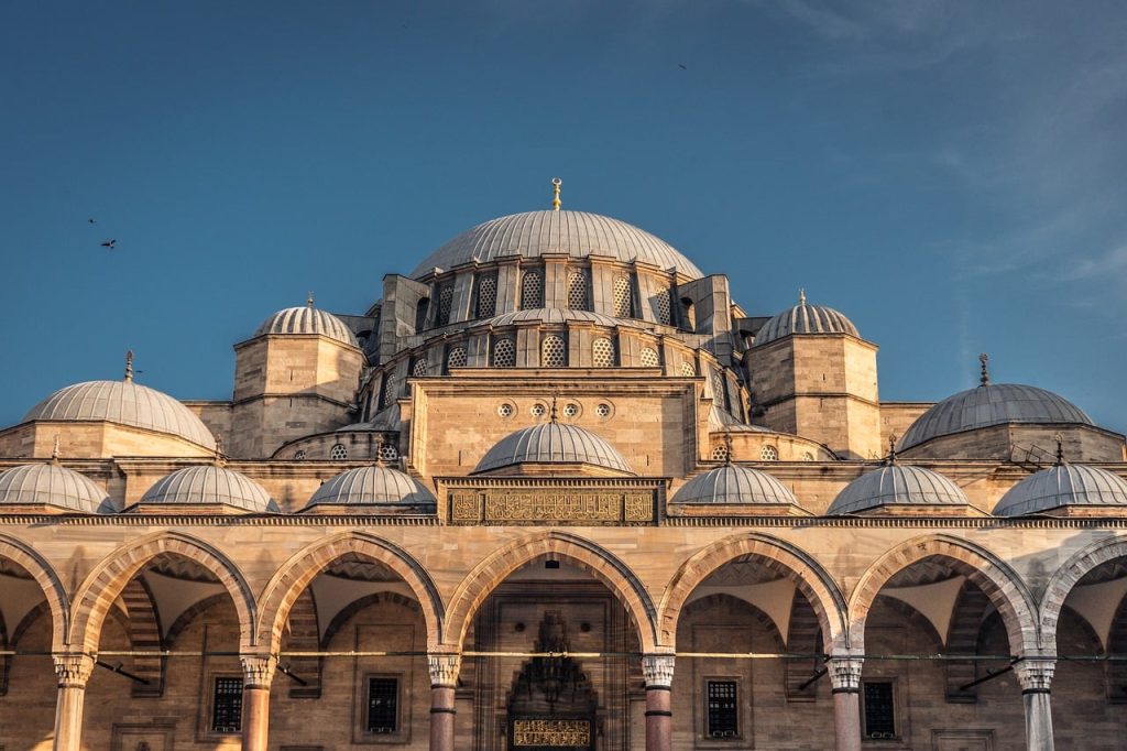 istanbul, turkey, suleymaniye mosque, mosque, ottoman architecture, islamic architecture, domes, arches, historic building, culture, religion, heritage, travel, tourism, skyline, architecture details, landmark, blue sky