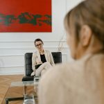 Therapist with client in a contemporary office setting, capturing a professional environment.