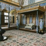 Elegant interior of Topkapi Palace showcasing Ottoman architecture with intricate decor and vibrant pattern details.
