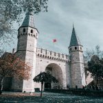 Historic entrance of Topkapı Palace captured during autumn in Istanbul.