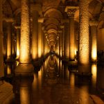 Explore the illuminated arches and columns of the ancient Basilica Cistern in Istanbul.