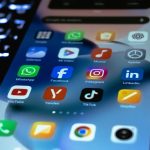 Close-up of a smartphone screen showing popular social media and utility app icons.