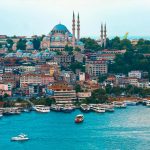 Aerial view of Istanbul featuring the historic Suleymaniye Mosque and bustling Bosphorus.